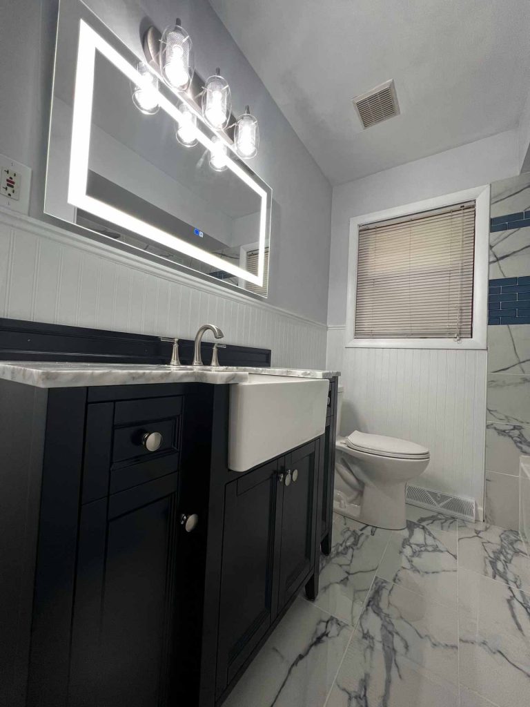 Clean bathroom with marbled tile floors