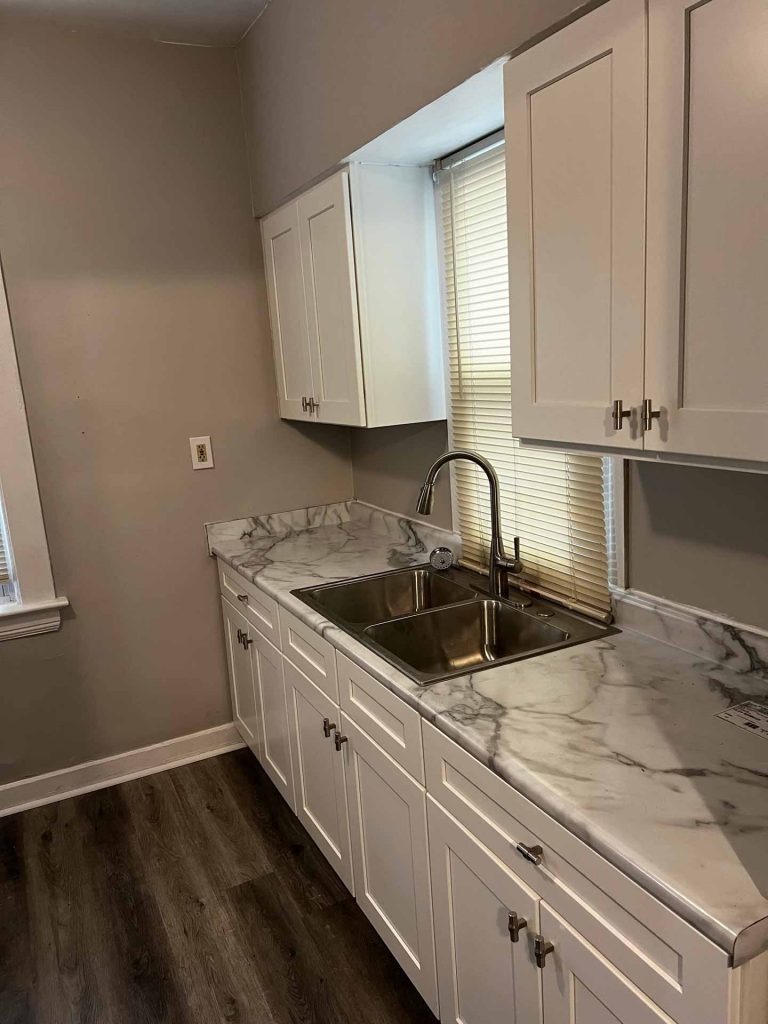 Kitchen sink with faux-marble countertops