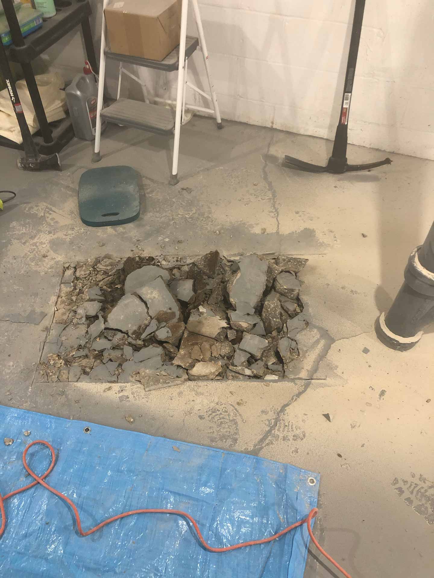 Digging a hole in a concrete basement floor
