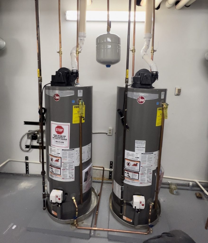 Two Rheem hot water heaters