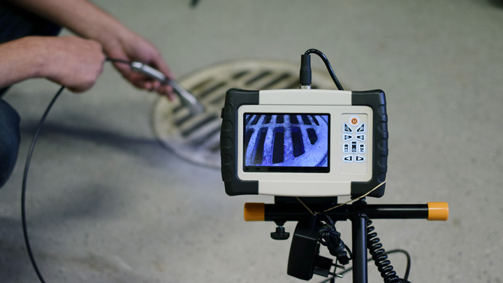 Inspecting a sewer with a pipe inspection camera